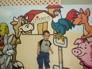 Colton posing in the petting area at the fair